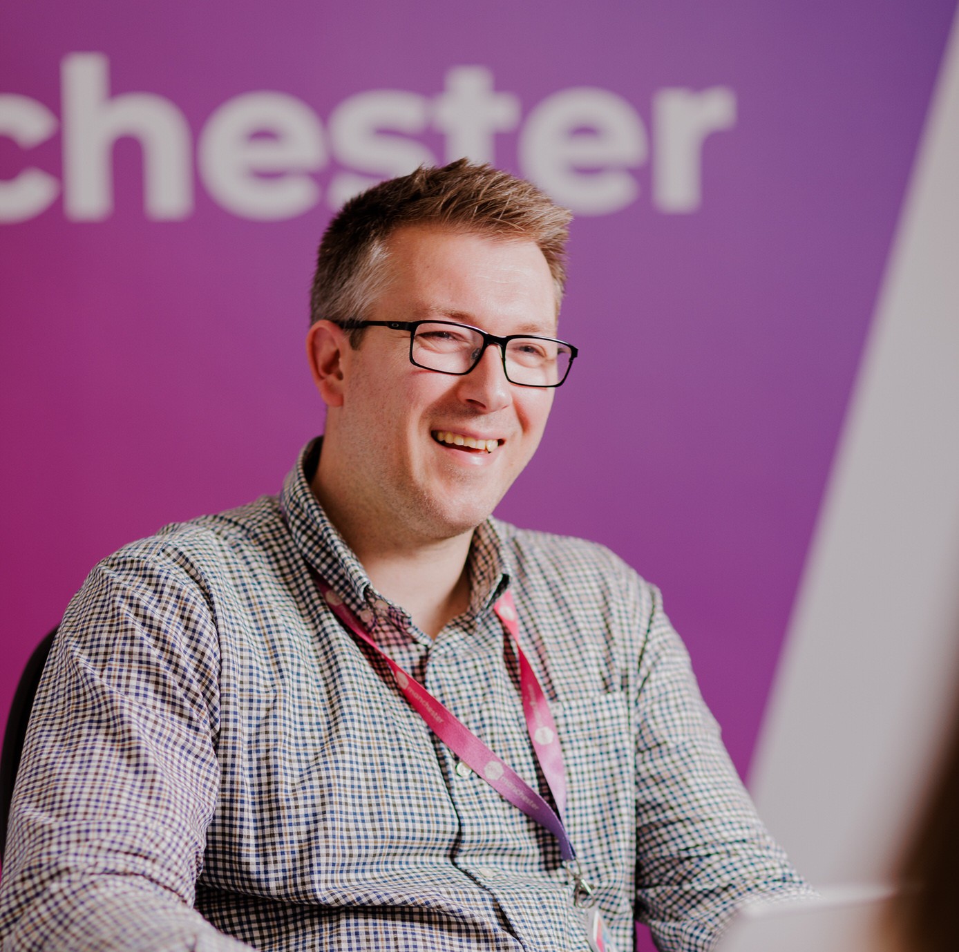 Colleague smiling in office