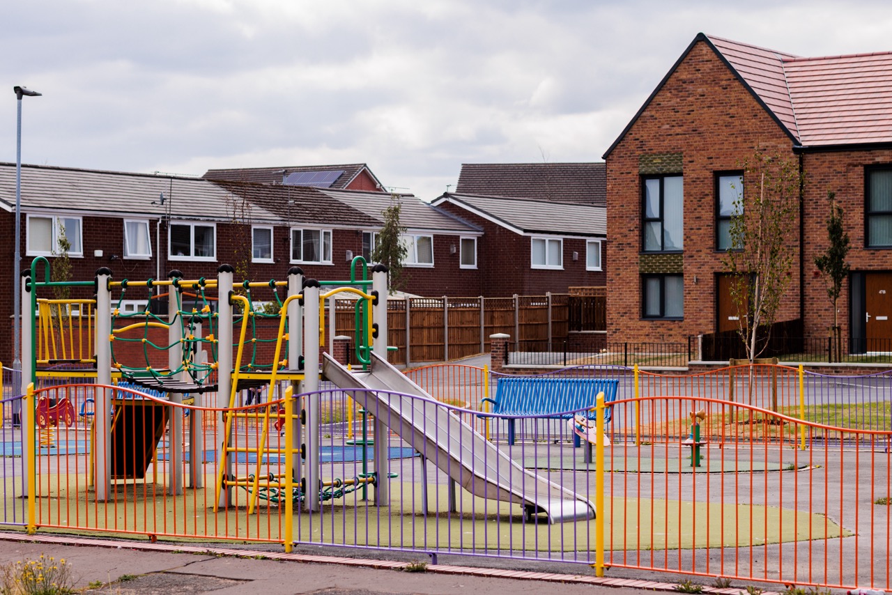 A playground within a new build housing estate