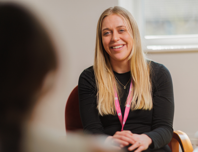 Colleague smiling at a customer