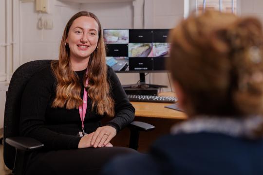 A neighbourhood officer talking to a customer