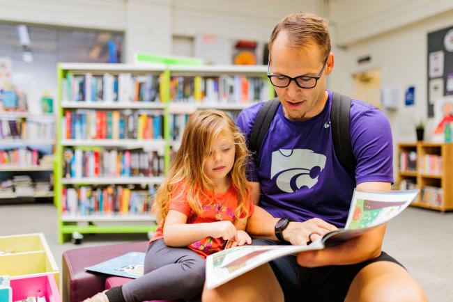 Father and daughter reading