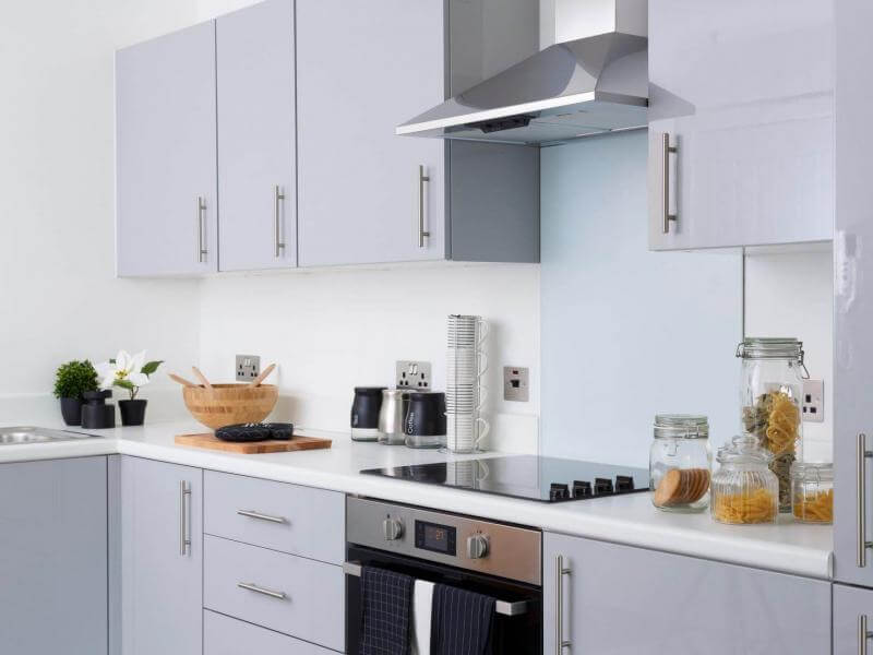 Photo of a kitchen at The Clockworks with pale grey cabinets