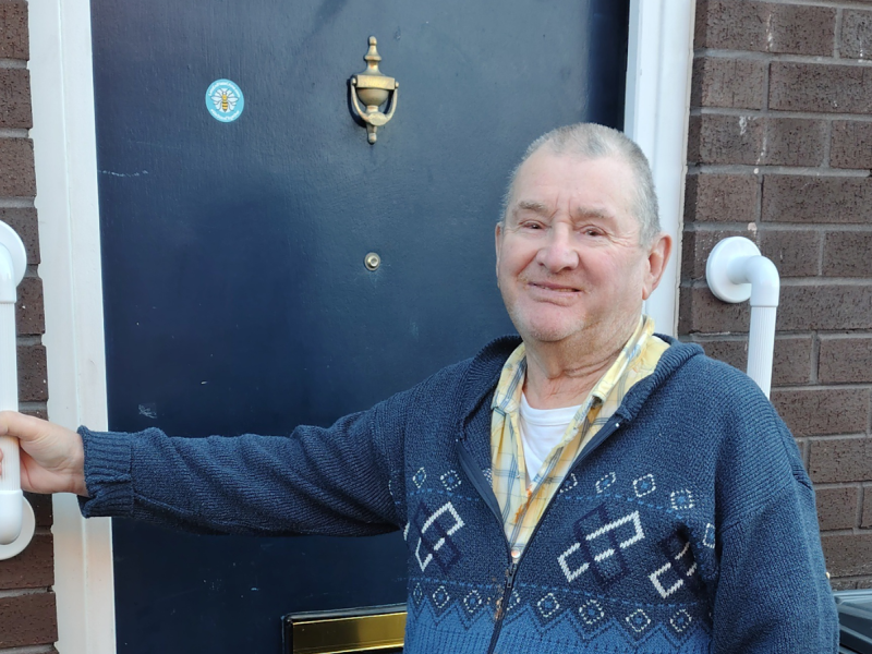 Ritchie outside his new home