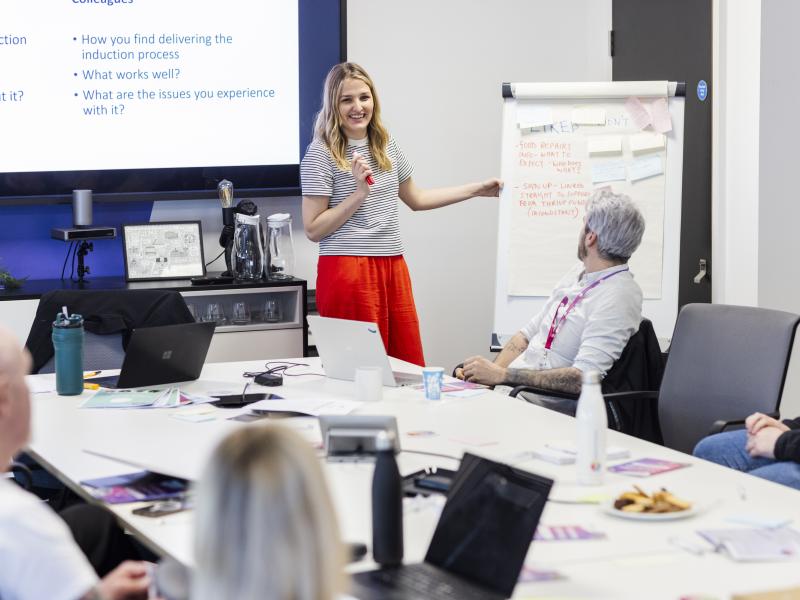 One Manchester Colleague introducing ideas at a meeting.