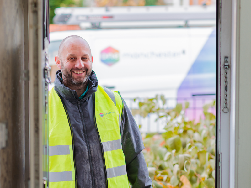 One Manchester Colleague stood at the door of a property waiting to enter. 