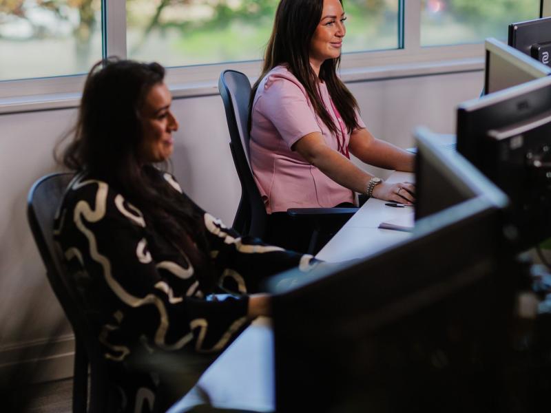 Two colleagues on calls