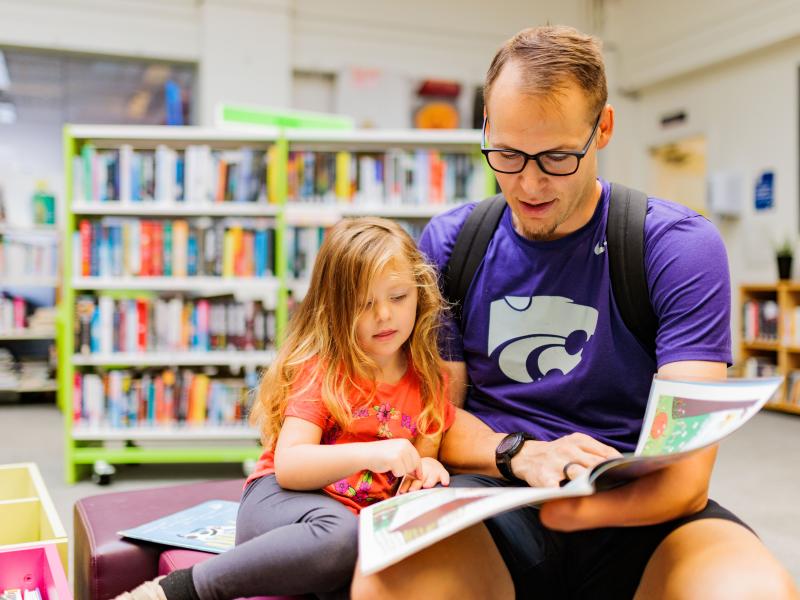 Father and daughter reading