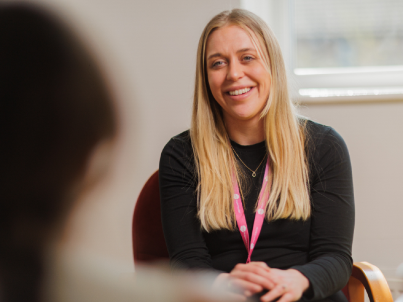 Colleague smiling at a customer