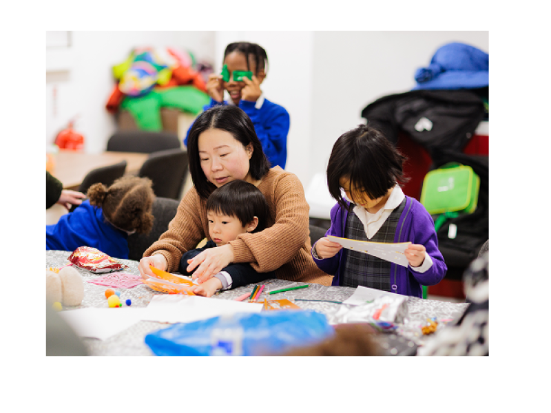 Mother and children doing crafts