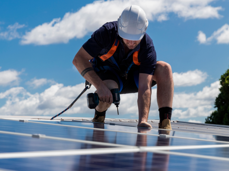 Person installing solar panels