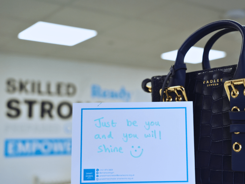 handbag next to 'confidence card' at Smart Works HQ