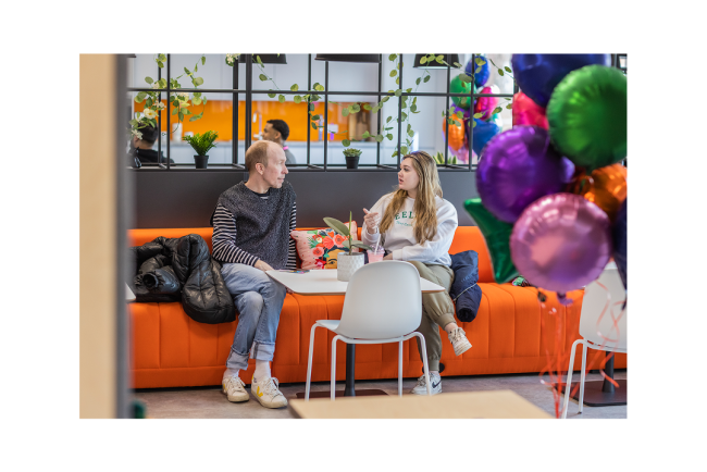 Colleague talking at One Manchester Offices