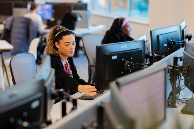 CRC team colleague sitting at a desk