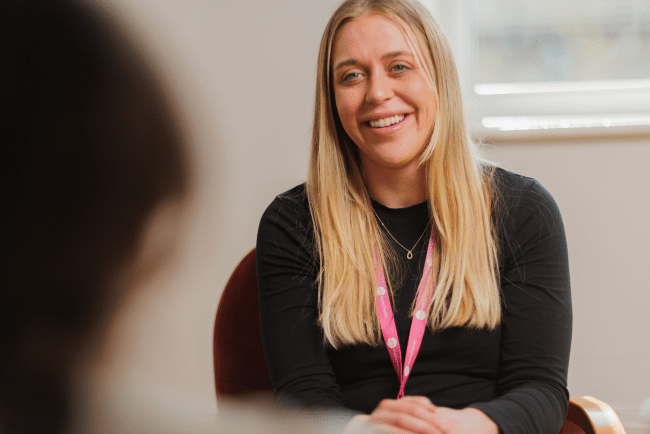Colleague smiling at a customer