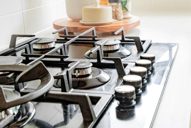 A gas hob situated on a worktop.