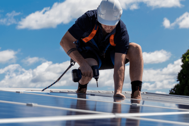 Person installing solar panels
