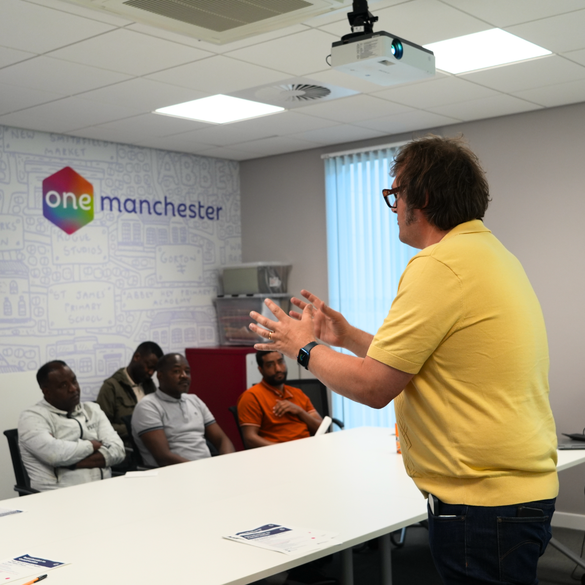 colleague presenting to a group of customers